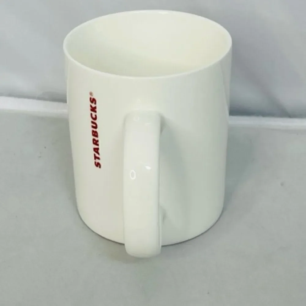 2014 Starbucks Coffee Mug Red Starburst Holiday Cup 12 oz Excellent - No cracks